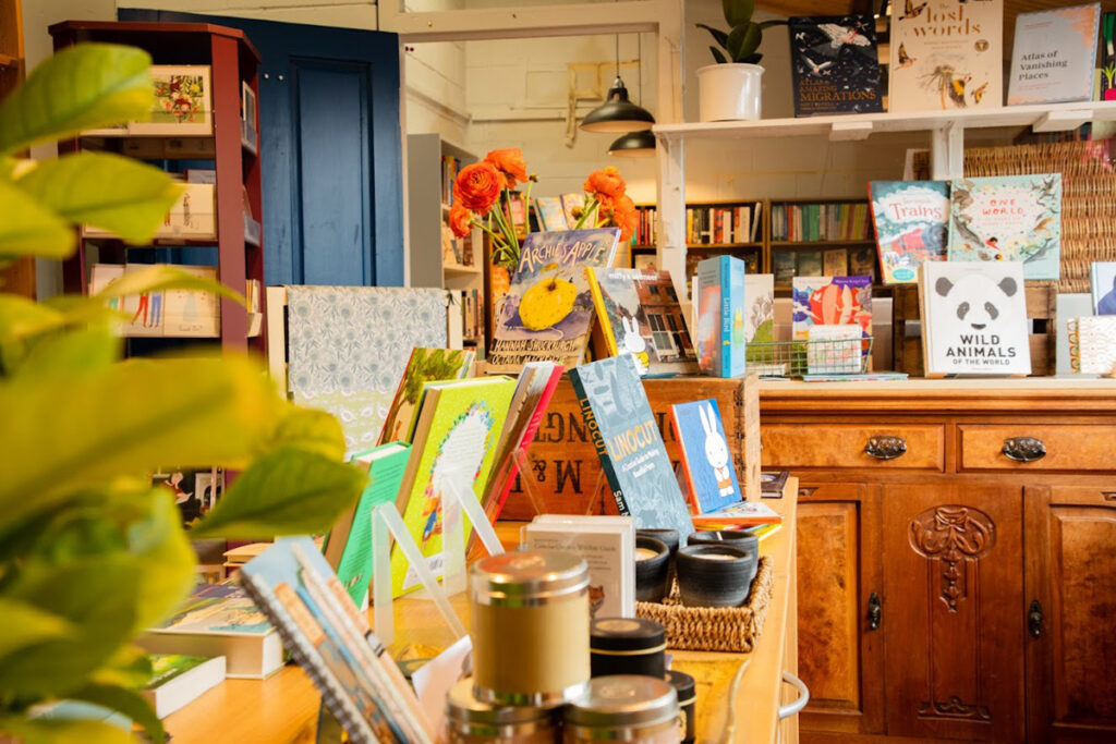 Bookshop internal candles and books and lemon tree by Nicky